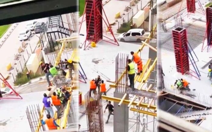 Albañiles se agarran de las greñas en lo alto de una construcción (VIDEO)